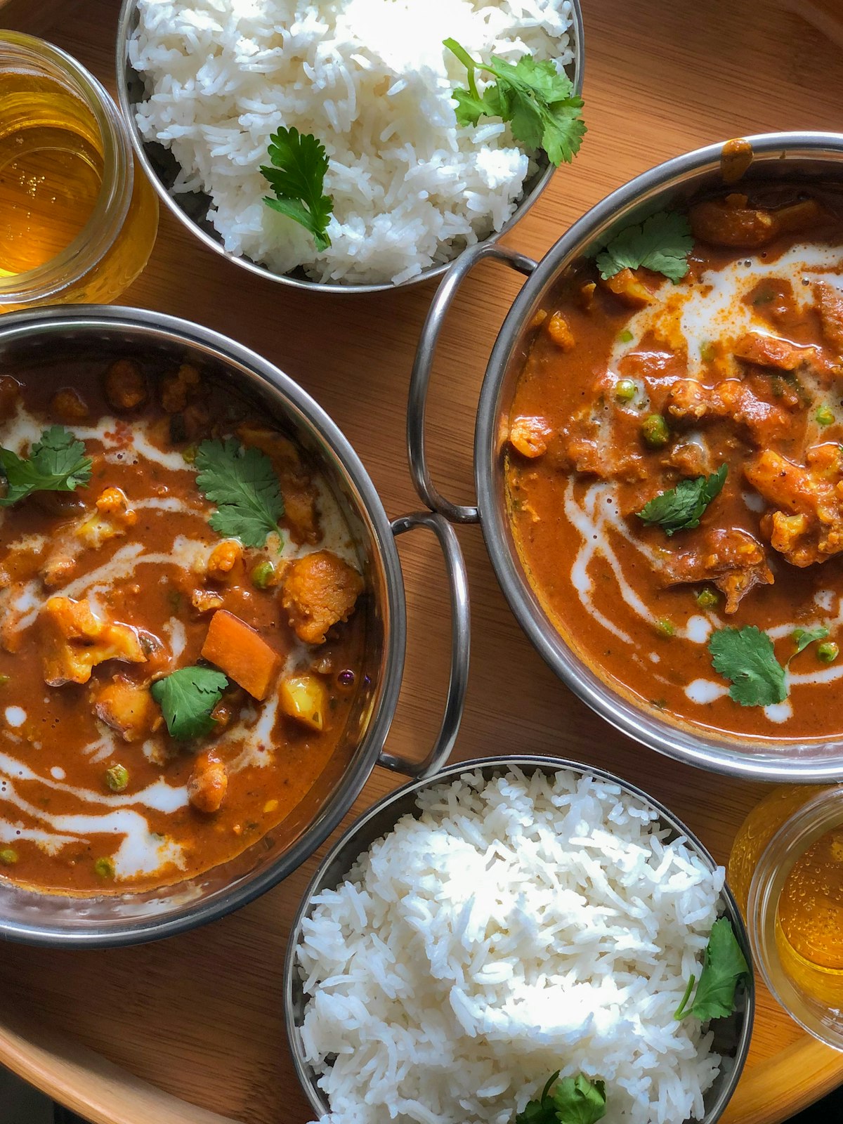A spread of curries with rice and raita